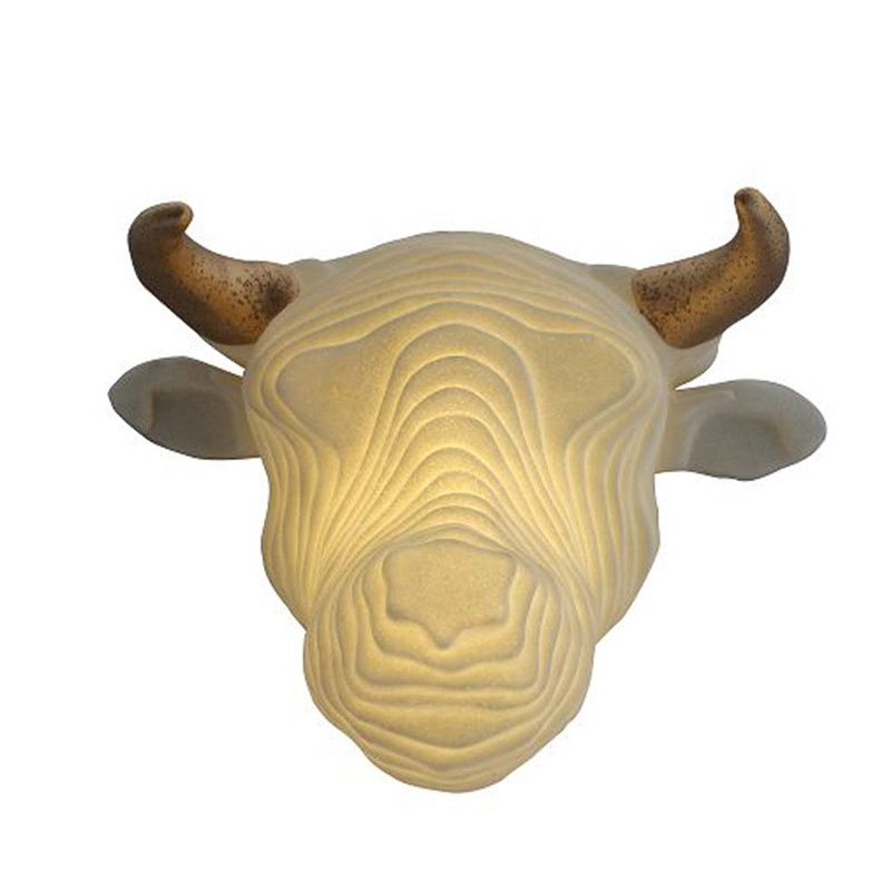 Luz LED de escultura de pared de arenisca con cabeza de vaca en capas