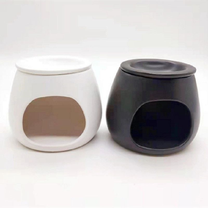 Quemador de cera de cerámica blanca y negra hecho a mano