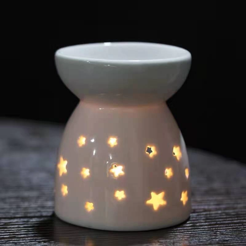 Lámpara de aceite esencial de vela de porcelana pequeña con huecos múltiples