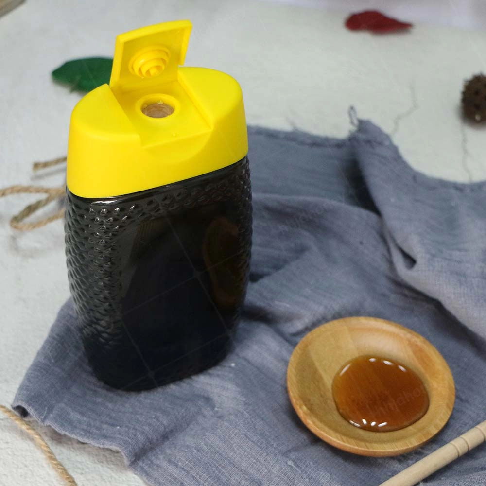 Botella con tapa de silicona de 500 g de miel de trigo sarraceno natural pura