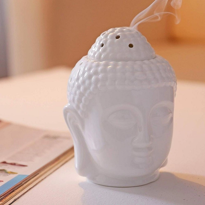 Ambientador de aire esencial del quemador de aceite de cerámica del aroma pacífico de la cabeza de Buda